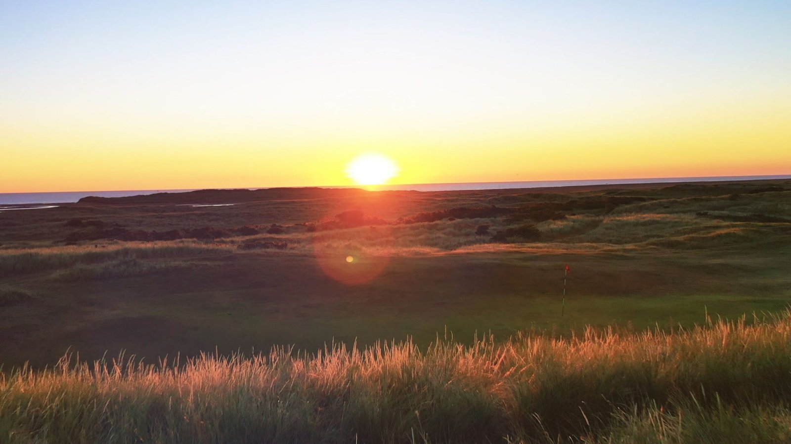 Sunset over the dunes at Goswick Golf Links on the Northumberland coast