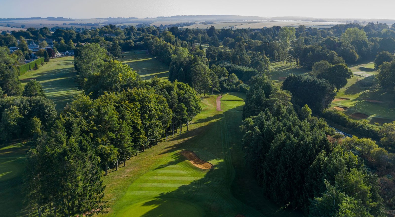 Burford Golf Club fairway through mature trees